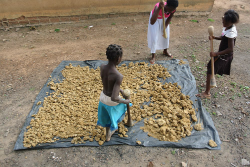 Girls Pounding Clay